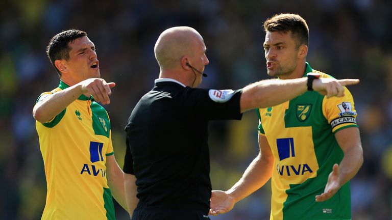Russel Martin (right) and Graham Dorrans of Norwich City appeal to referee Simon Hooper after a disallowed goal.