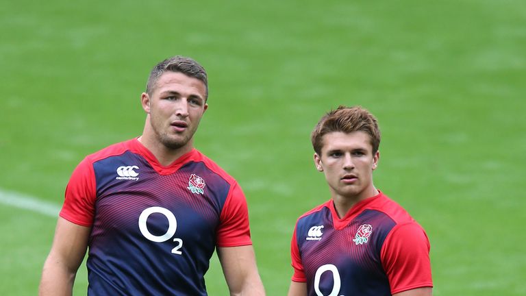 Sam Burgess (L) and Henry Slade, England's midfield partnership, look on at training