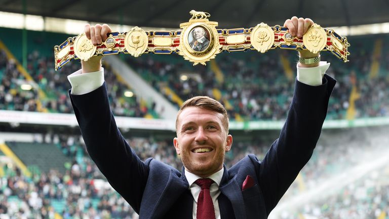 Scott Cardle shows off his British lightweight title to the Celtic fans 