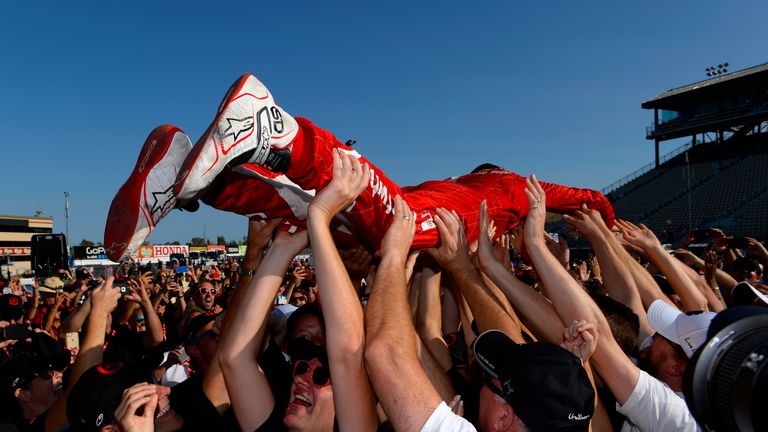 Dixon crowd-surfs at Sonoma after winning IndyCar crown