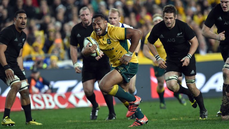 Australia's Sekope Kepu (C) runs in a try against the New Zealand All Blacks during the Bledisloe Cup Test match as part of the Rugby Championship