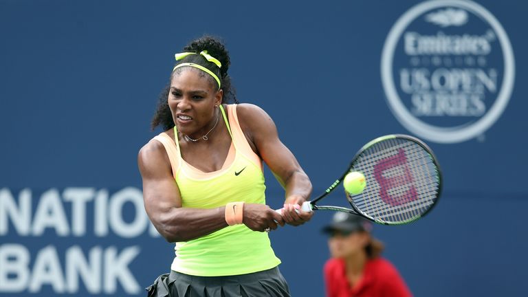 Serena Williams of the USA plays a shot against Flavia Pennetta of Italy during Day 2 of the Rogers Cup at the 