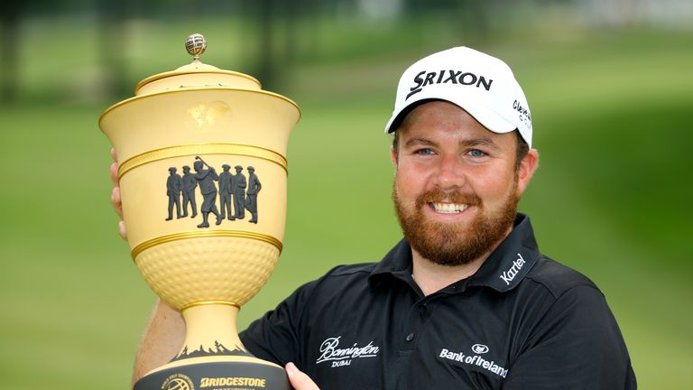 Shane Lowry of Ireland holds the Gary Player Cup after winning the World Golf Championships - Bridgestone Invitational