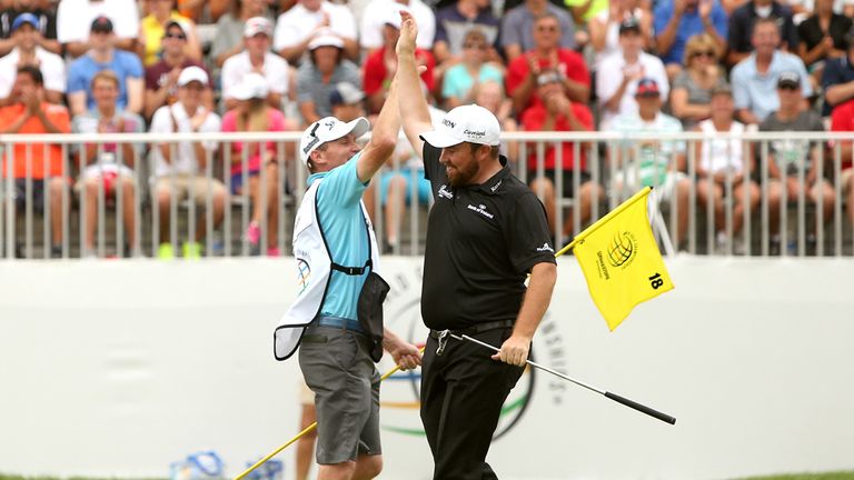 AKRON, OH - AUGUST 09:  Shane Lowry of Ireland (R) celebrates with his caddie Dermot Byrne after a birdie putt on the 18th green during the final round of 