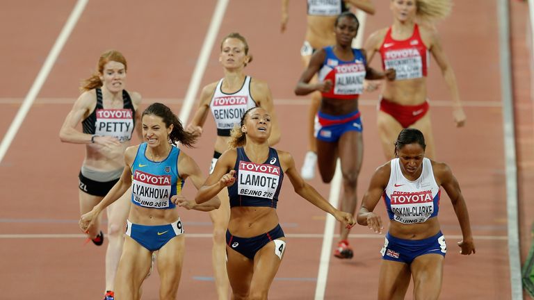 Shelayna Oskan-Clarke of Great Britain (right) crosses the finish line in the Women's 800 metres semi-final
