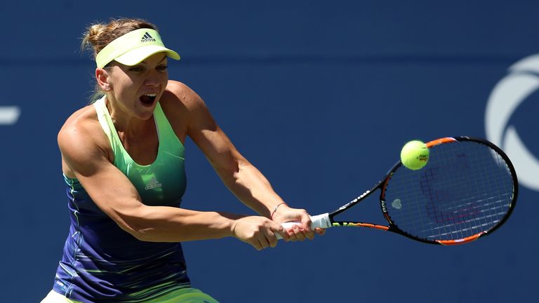 Simona Halep of Romania plays a shot against Jelena Jankovic of Serbia during Day 3 of the Rogers Cup 