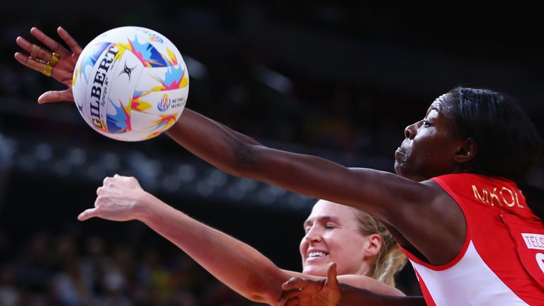 Caitlin Bassett of Australia and Sonia Mkoloma of England compete for the ball during the 2015 Netball World Cup Qualification