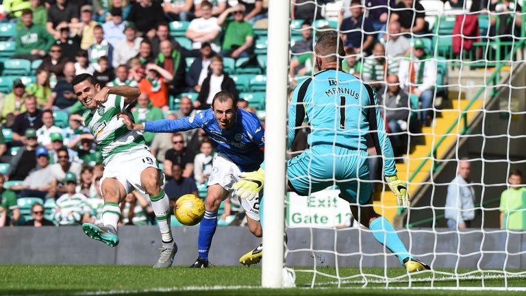 Celtic's Tom Rogic (left) puts his side ahead for the first time just before half-time
