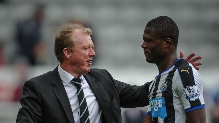 Newcastle boss Steve McClaren (L) shakes hands with Chancel Mbemba (R)