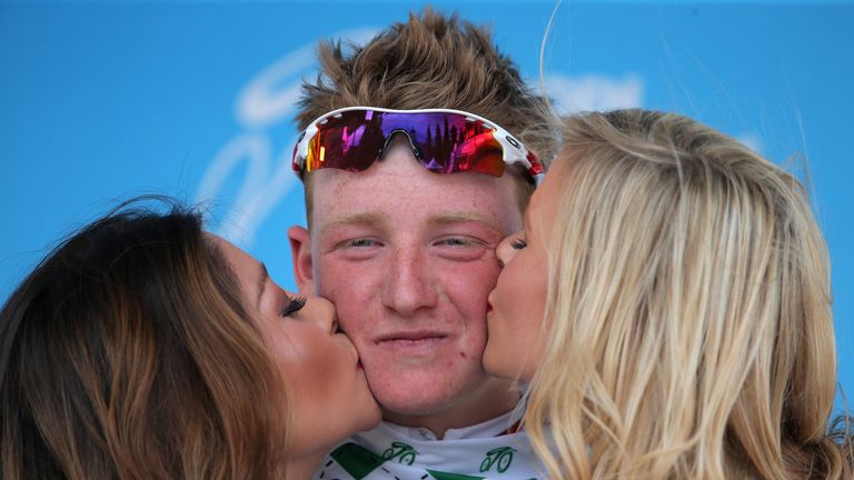 Tao Geoghegan Hart of Great Britain riding for the Bissell Development Team is awarded the best young rider's jersey after his fo