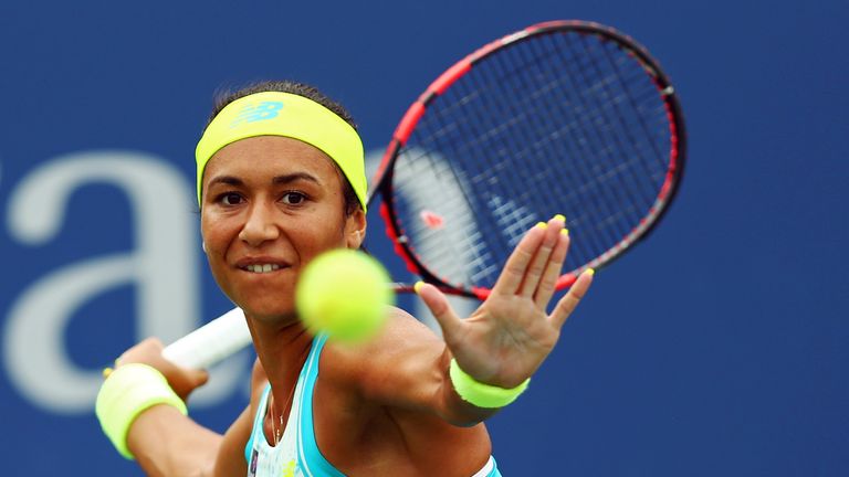 Heather Watson of Great Britain returns a shot to Lauren Davis of the United States at the US Open
