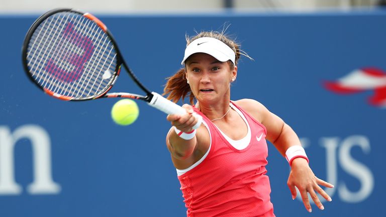 Lauren Davis of the United States returns a shot to Heather Watson of Great Britain at the US Open