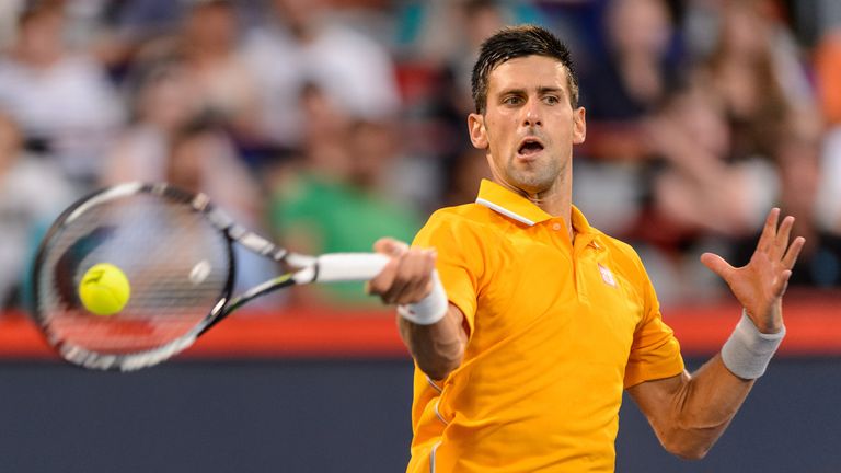 Novak Djokovic hits a return against Ernests Gulbis at the Montreal Masters