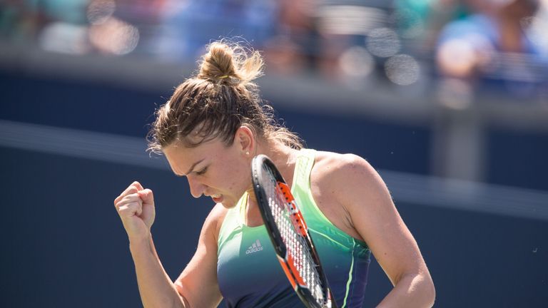 Simona Halep celebrates a point during her semi- final match against Sara Errani at the Rogers Cup in Toronto