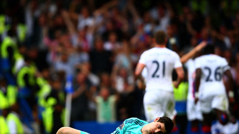 Thibaut Courtois of Chelsea reacts after conceding Crystal Palace's first goal 