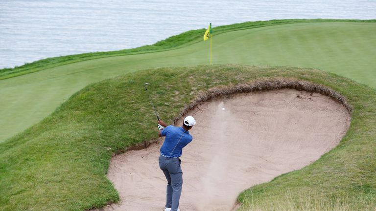 SHEBOYGAN, WI - AUGUST 13:  Tiger Woods of the United States plays a bunker shot on the 17th hole during the first round of the 2015 PGA Championship 