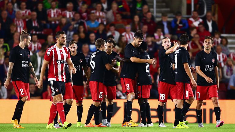 Tim Sparv of Midtjylland is congratulated by team mates after scoring.