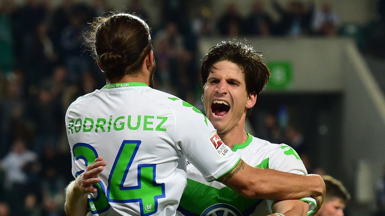 Wolfsburg's Swiss defender Timm Klose (R) celebrates with Wolfsburg's Swiss defender Ricardo Rodriguez
