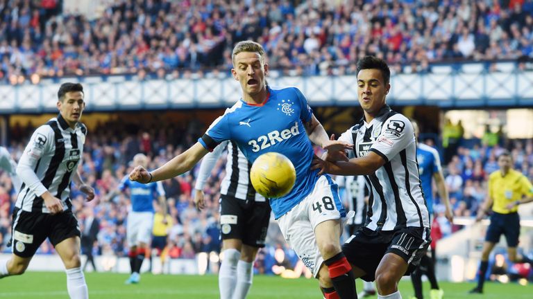 Rangers' Tom Walsh (left) holds off St Mirren scorer Cameron Howieson (right) at Ibrox
