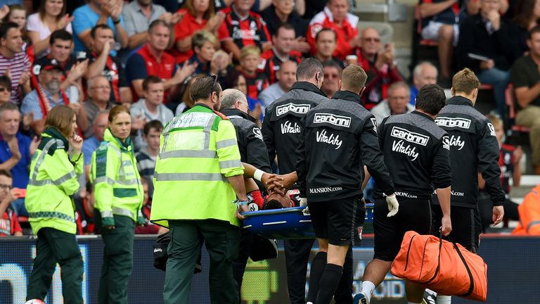 BOURNEMOUTH, ENGLAND - AUGUST 29: Tyrone Mings of Bournemouth is taken off the pitch by stretcher after picking up injury during the Barclays Premier Leagu