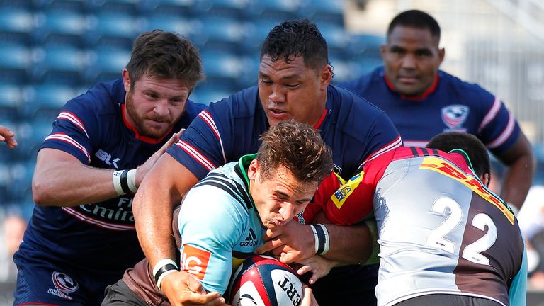 Tito Tebaldi of Harlequins is tackled by Olive Kilifi of the USA Eagles