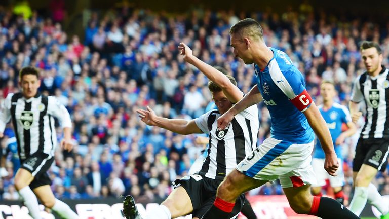 Rangers' Lee Wallace (5) surges forward to score his second of the match 