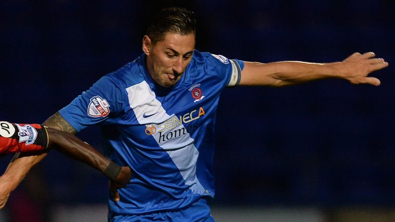 AFC Bournemouth's Christian Atsu (left) and Hartlepool United's Billy Paynter battle for the ball during the Capital One Cup, second round match at Victori