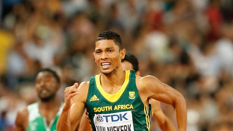 BEIJING, CHINA - AUGUST 26:  Wayde Van Niekerk of South Africa crosses the finish line to win gold in the Men's 400 metres final during day five of the 15t