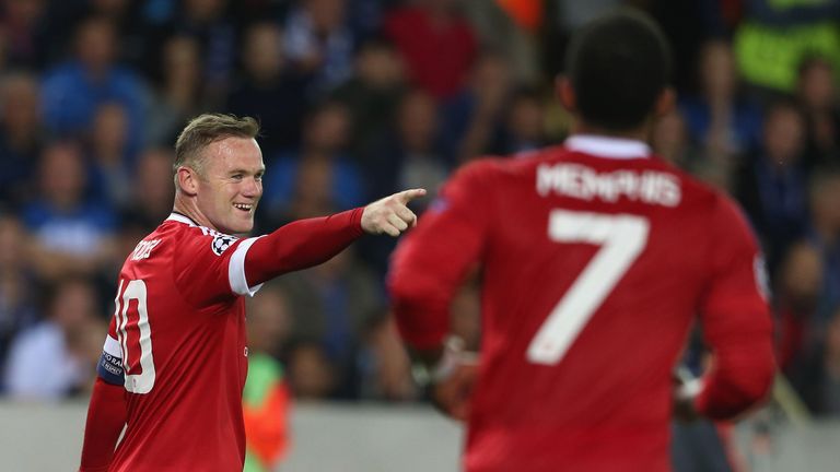 Wayne Rooney of Manchester United celebrates scoring their third goal during the UEFA Champions League play-off second leg match v Club Brugge