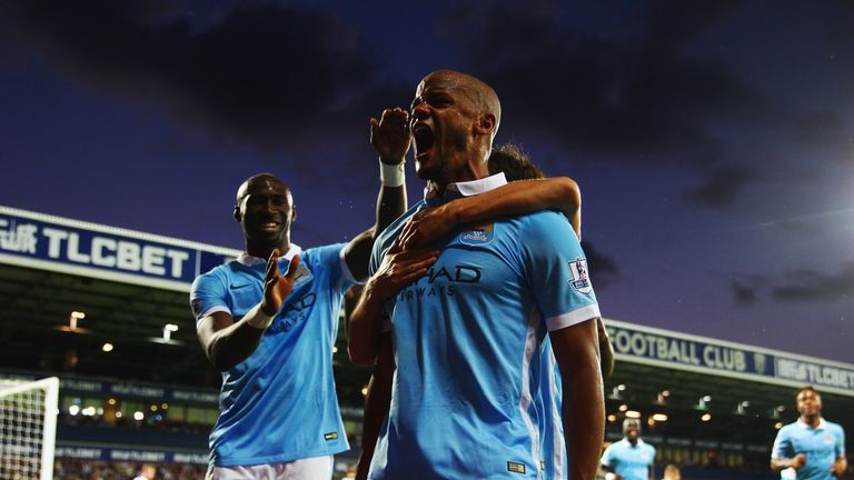 Vincent Kompany of Manchester City celebrates as he scores their third goal against West Brom on August 10, 2015