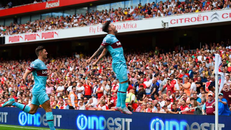 Mauro Zarate leaps in celebration after doubling West Ham's lead