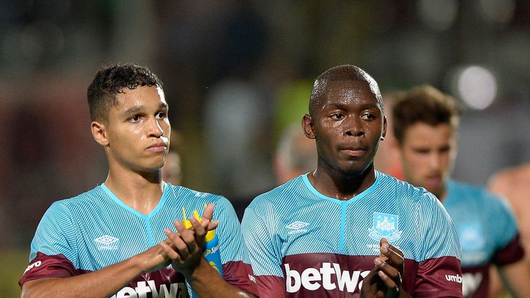 West Ham United's Kyle Knoyle, left, and Jordan Brown, right, salute supporters