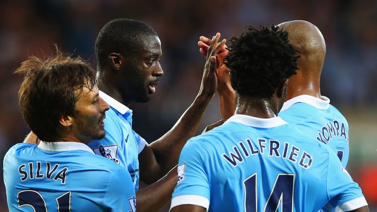Yaya Toure of Manchester City (2L) celebrates with team mates David Silva (L), Wilfred Bony (2R) and Vincent Kompany (R) as he scores their second goal