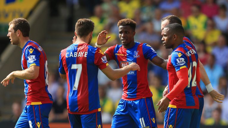 Wilfried Zaha (middle) celebrates his opening goal for Crystal Palace against Norwich.