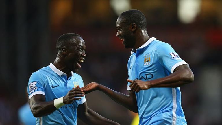 Yaya Toure celebrates his second goal with Bacary Sagna