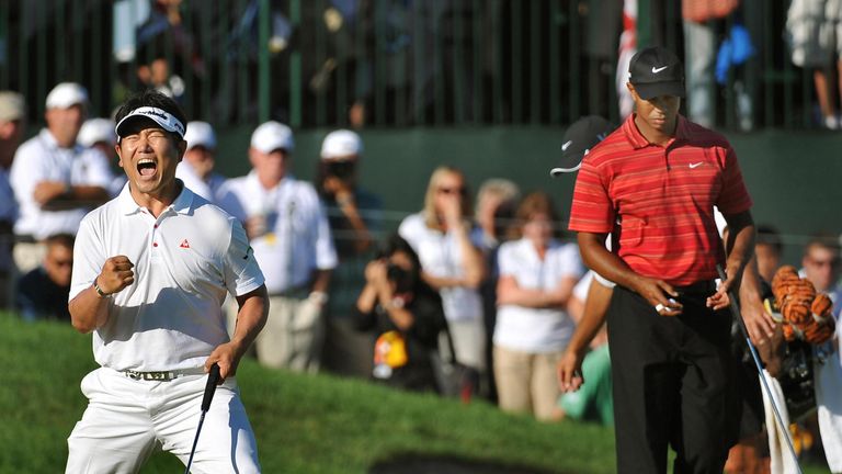 Woods can only look on as Yang holes a winning putt 