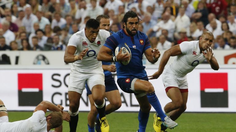 France winger Yoann Huget runs through for a try