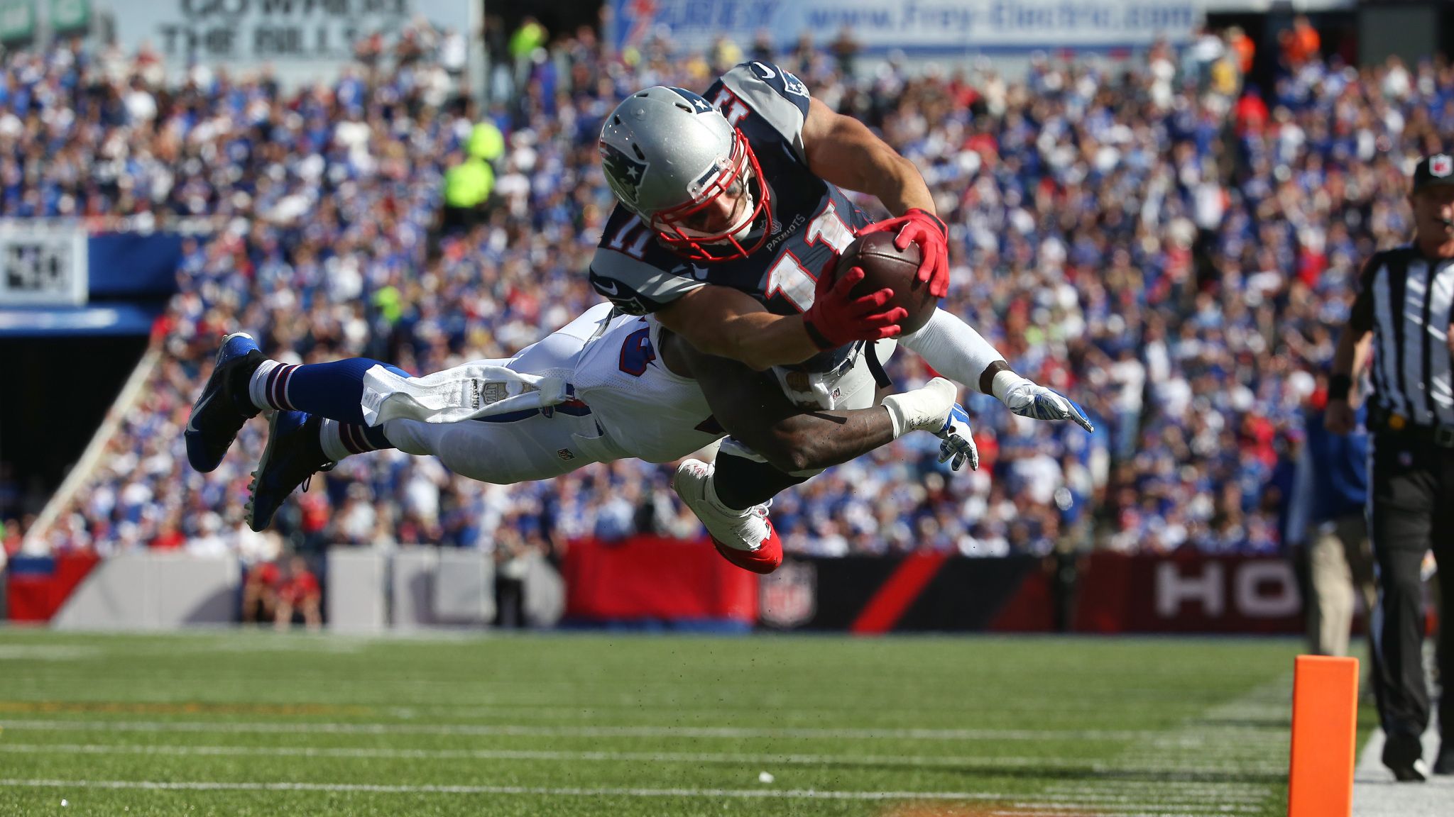 New England Patriots wide receiver Julian Edelman (11) is tackled by  Buffalo Bills linebacker Preston Brown (52) during the first half of an NFL  football game Sunday, Sept. 20, 2015, in Orchard