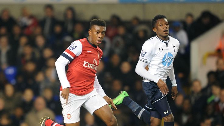 Alex Iwobi of Arsenal alongside Alex McQueen of Tottenham in the Barclays U21 Premier League in March 2014.