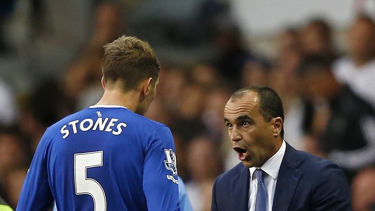 Everton defender John Stones and manager Roberto Martinez