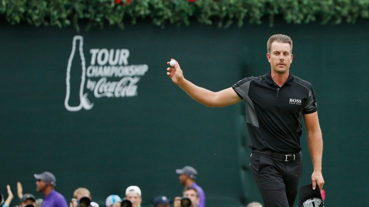 Henrik Stenson salutes the crowd after his spectacular closing birdie