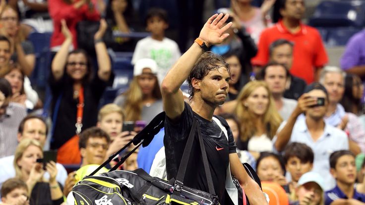 A dejected Rafael Nadal  walks off the court after his loss to Fabio Fognini at the US Open