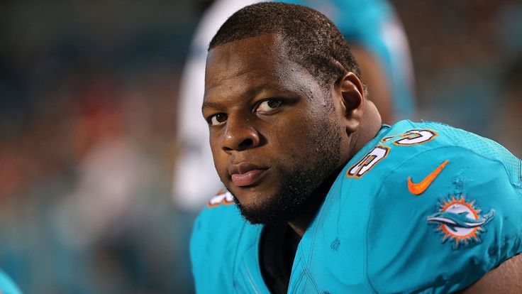 Ndamukong Suh #93 of the Miami Dolphins looks on during a preseason game against the Atlanta Falcons at Sun Life Stadium on