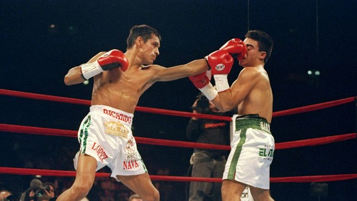 23 Aug 1997:  Ricardo Lopez lands a blow on Alex Sanchez during a bout at Madison Square Garden in New York City, New York.  Lopez won the fight with a TKO