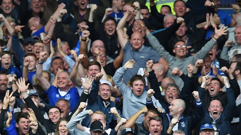 Aaron Lennon (L) celebrates after Steven Naismith scored his third goal during the match between Everton and Chelsea