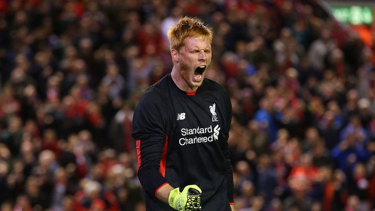 Adam Bogdan of Liverpool celebrates after saving a penalty from Danny Grainger