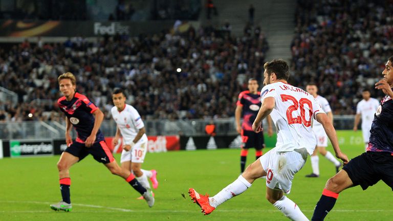 Liverpool's Adam Lallana shoots to score against Bordeaux