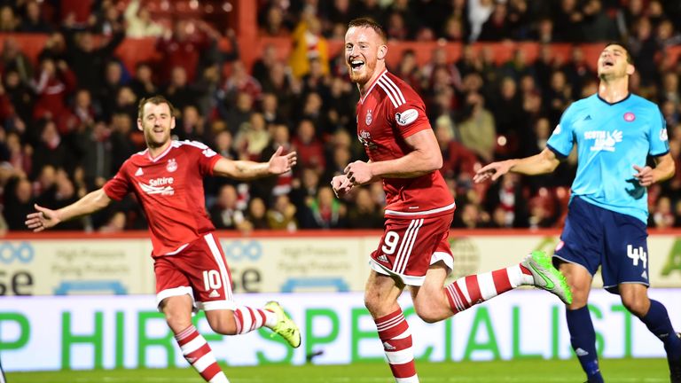 Aberdeen's Adam Rooney celebrates having fired home from the penalty spot to put his side ahead against Hamilton.