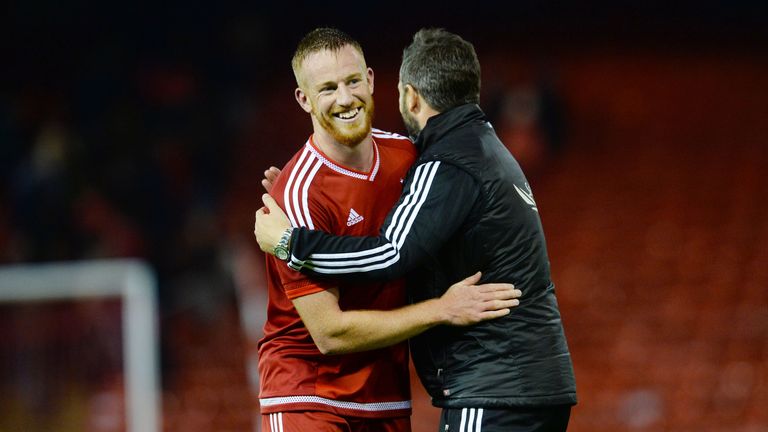 Aberdeen's Adam Rooney (left) celebrates with manager Derek McInnes as his side claim victory over Hamilton 