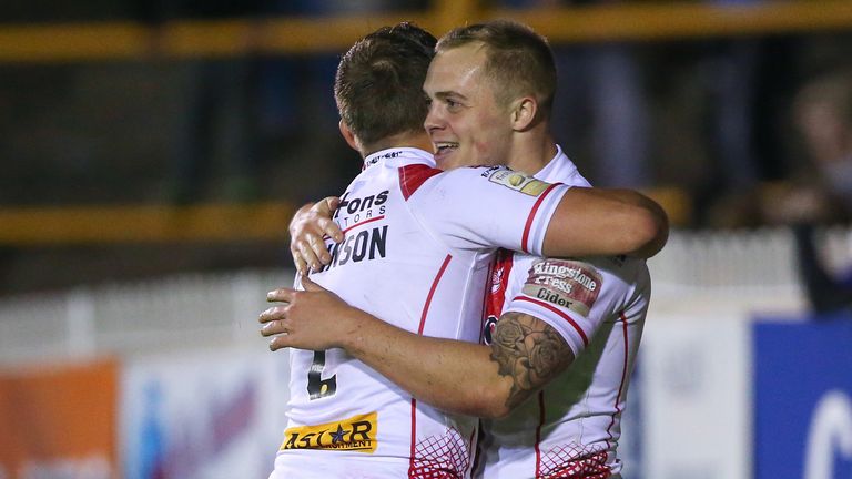 St Helens' Adam Swift (R) celebrates his try with Tommy Makinson (L)